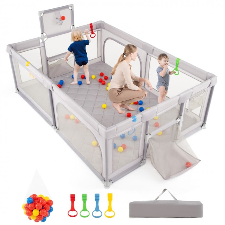 Extra large light gray playpen with basketball hoop, ocean balls, and soft foam mat for safe toddler playtime.