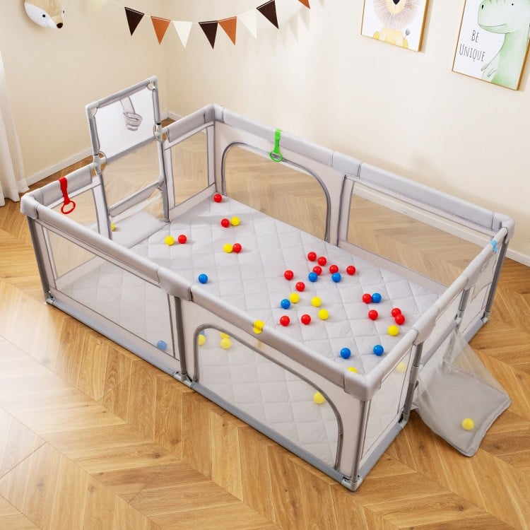 Extra large light gray playpen with basketball hoop, mesh sides, and 50 ocean balls for safe baby playtime.