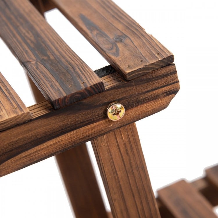 Close-up of the wooden shelf's slatted design and sturdy construction, ideal for displaying plants indoors or outdoors.