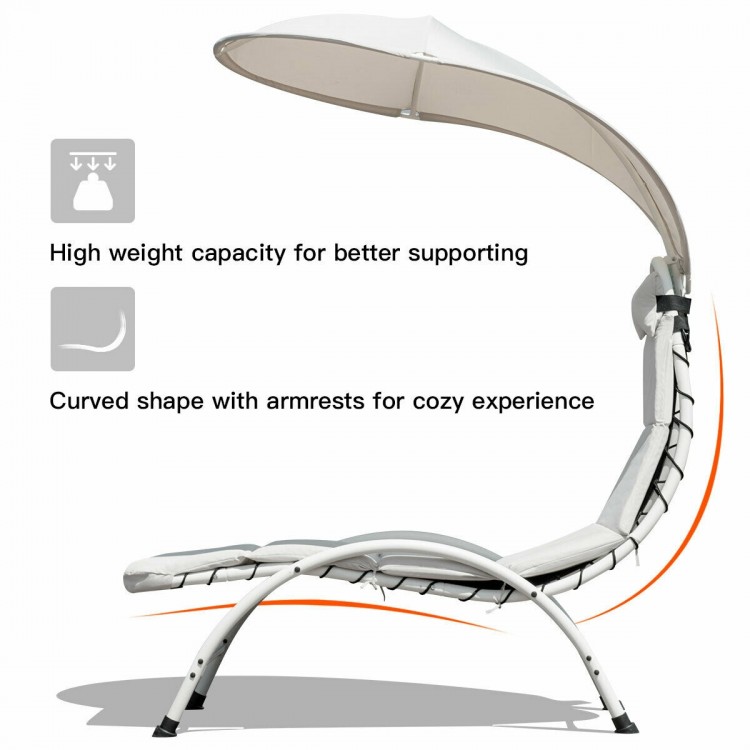 Curved chaise lounge chair with beige canopy, durable steel frame, and soft cushion for backyard relaxation.