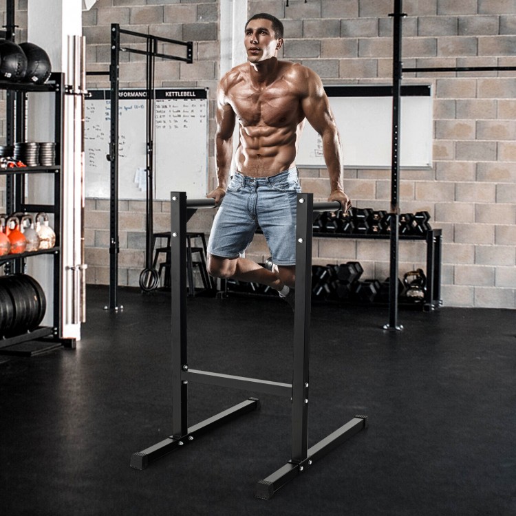 Multifunctional dip stand with foam handles, sturdy metal frame, ideal for home gym workouts and full body exercises.