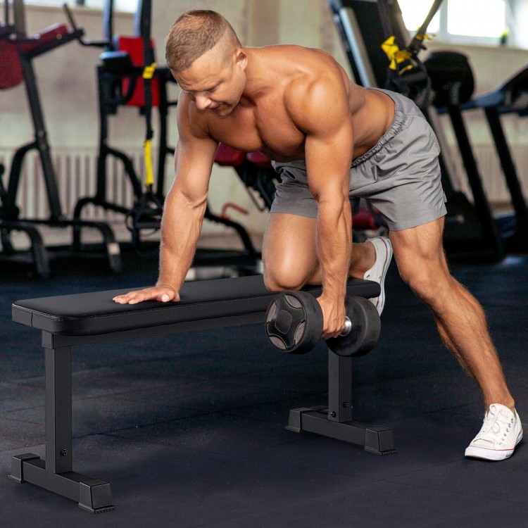 Flat weight bench with a durable black finish, supporting 660 lbs for strength training at home or gym.