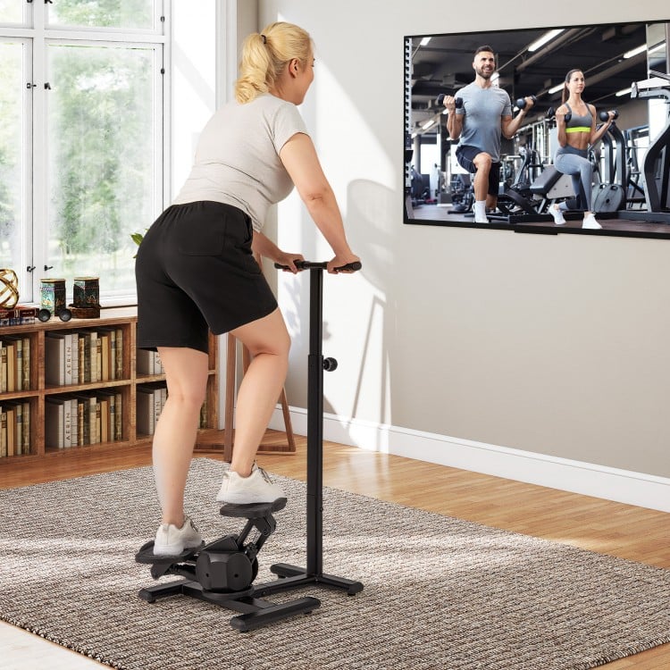 Twist stair stepper in black with adjustable handlebar, used for low-impact home workouts and fitness tracking.