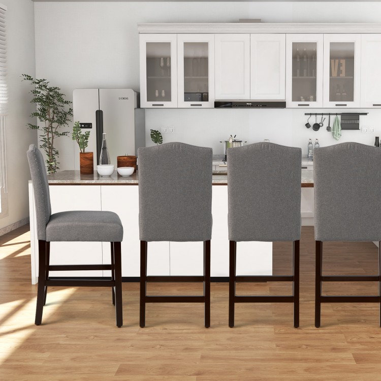 Gray fabric counter height dining chair with rubberwood legs and nail head design, perfect for kitchen or bar use.