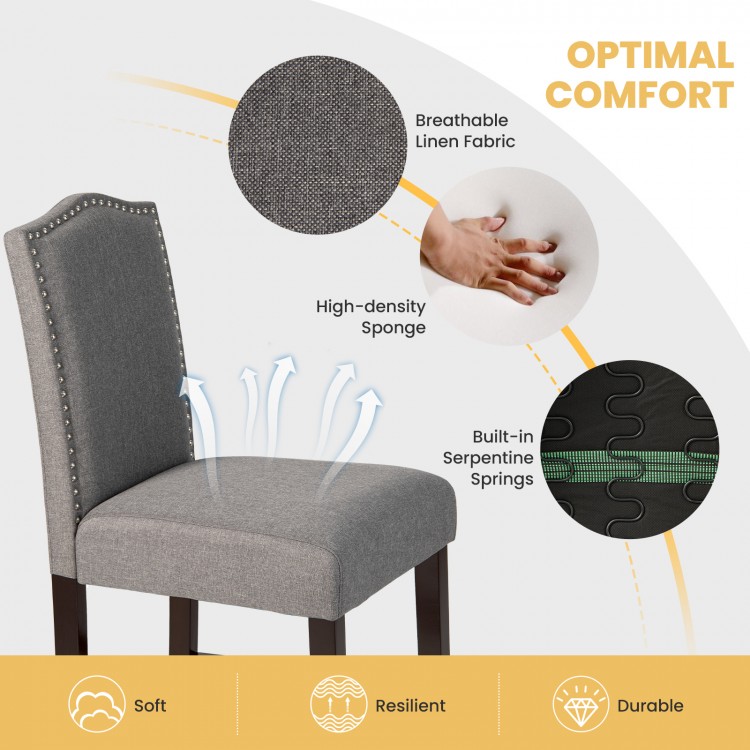 Gray fabric dining side chair with nail head trim, breathable linen, and high-density sponge for optimal comfort.