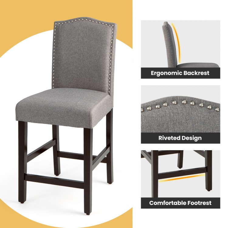 Gray fabric counter height dining chair with ergonomic backrest, riveted design, and comfortable footrest for stylish.