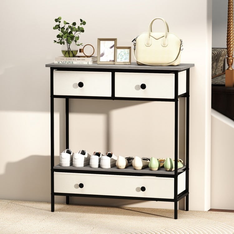 Farmhouse console table in gray with three drawers and open shelf, perfect for hallway storage and display.