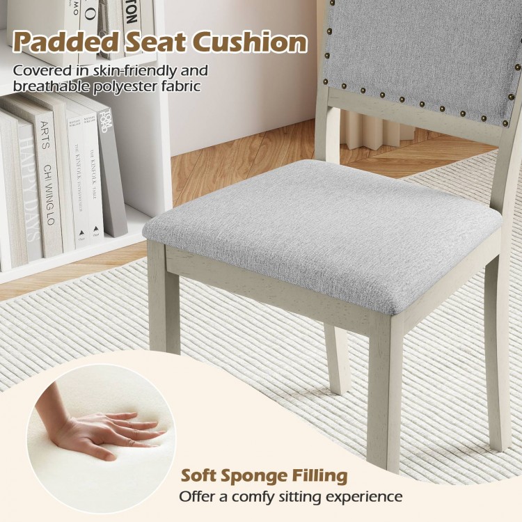 Padded seat cushion of a grey farmhouse dining chair, featuring soft sponge filling for a comfy sitting experience.