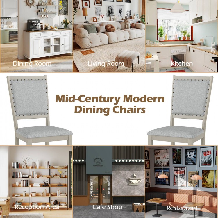 Grey upholstered farmhouse dining chairs with vintage nailheads, perfect for dining rooms, cafes, and restaurants.