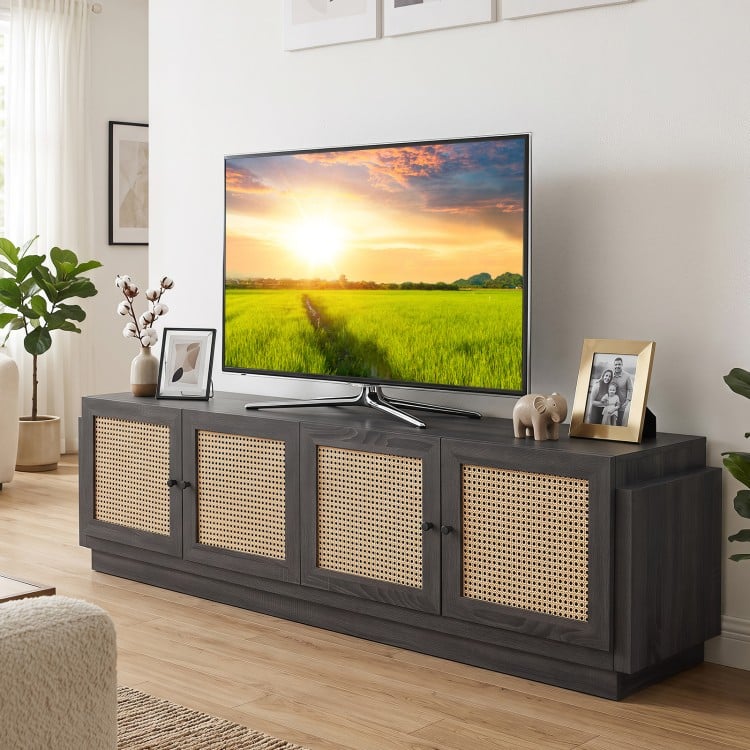 Farmhouse TV stand in black showcases a wide tabletop and elegant rattan doors, ideal for stylish living room organization.