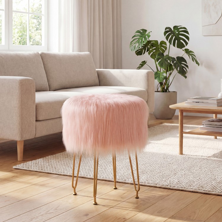 Faux fur vanity stool chair in pink with metal legs, perfect for bedroom or living room decor and compact storage.