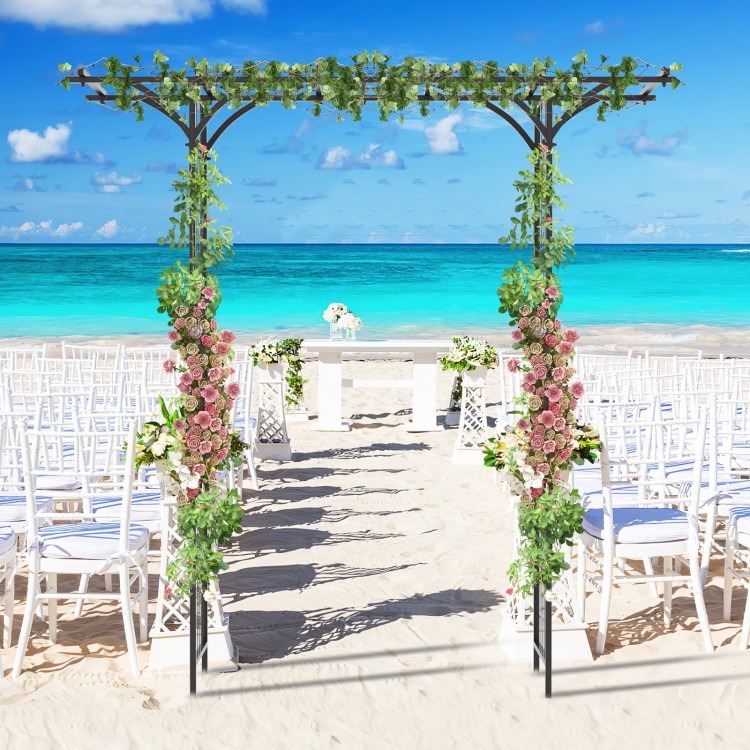 Garden arbor with trellises for climbing plants, adorned with flowers, perfect for weddings and outdoor events by the.