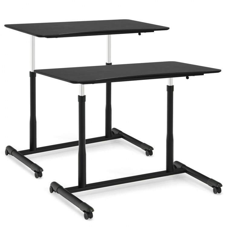 Height adjustable black computer desk with dual surfaces, rolling wheels, and ergonomic design for home or office use.