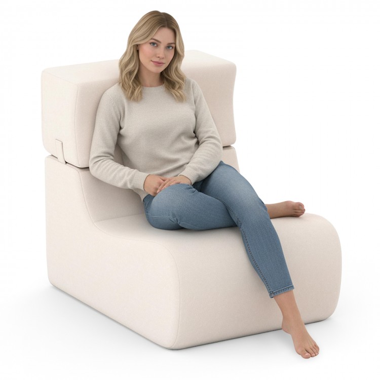 Curved beige floor chair with detachable headrest, ideal for relaxing, reading, or watching TV in any room.
