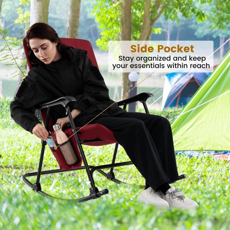 Foldable rocking padded camping chair in red with side pocket, perfect for outdoor relaxation and easy storage.