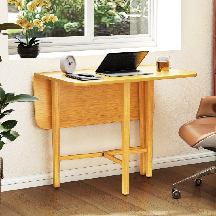 Foldable dining table in natural finish with rubber wood legs, ideal for small spaces, featuring drop leaf design.