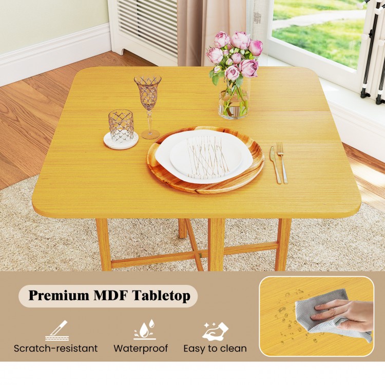 Foldable dining table for 2-4 people with natural MDF tabletop, rubber wood legs, and easy-to-clean surface.