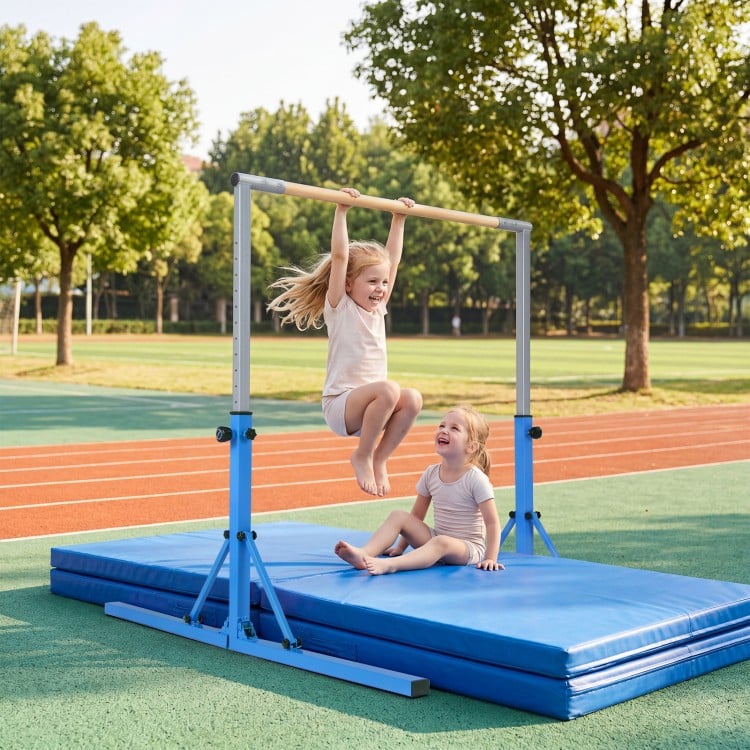 Kids enjoy swinging on the foldable blue gymnastics bar, adjustable from 35.5" to 59" for versatile training.
