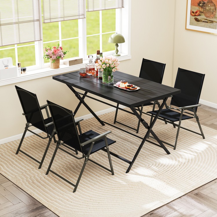Foldable black metal outdoor dining table with slatted tabletop and four chairs, perfect for patio gatherings.