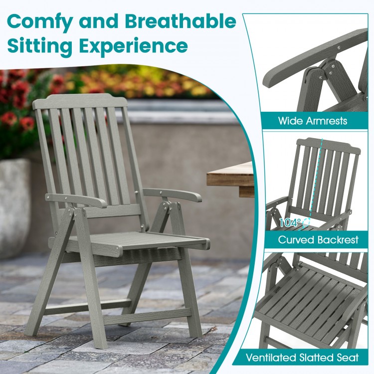 Gray foldable patio chair with wide armrests and slatted seat, made of weatherproof HDPE for outdoor dining.