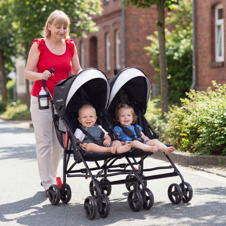 Foldable twin baby double stroller in black with adjustable backrest, lightweight frame, and two children seated.