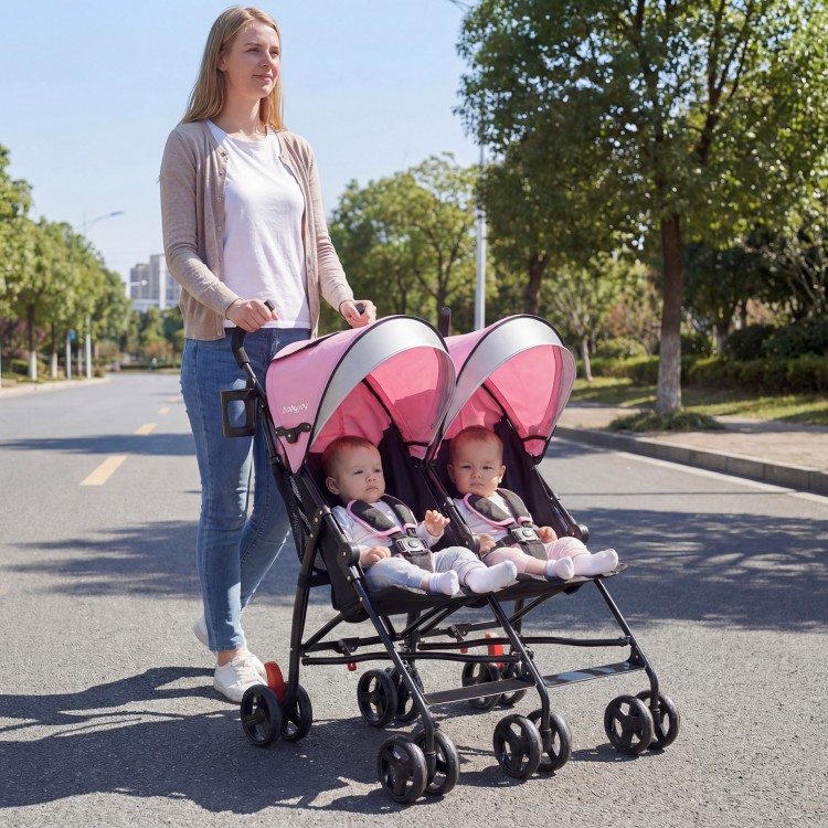 Twin baby stroller in pink, featuring an umbrella fold design, 360-degree swivel wheels, and a lightweight frame for.