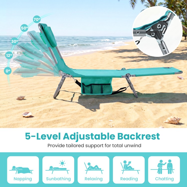 Folding beach lounge chair in light green with 5 adjustable backrest positions for versatile relaxation at the beach.