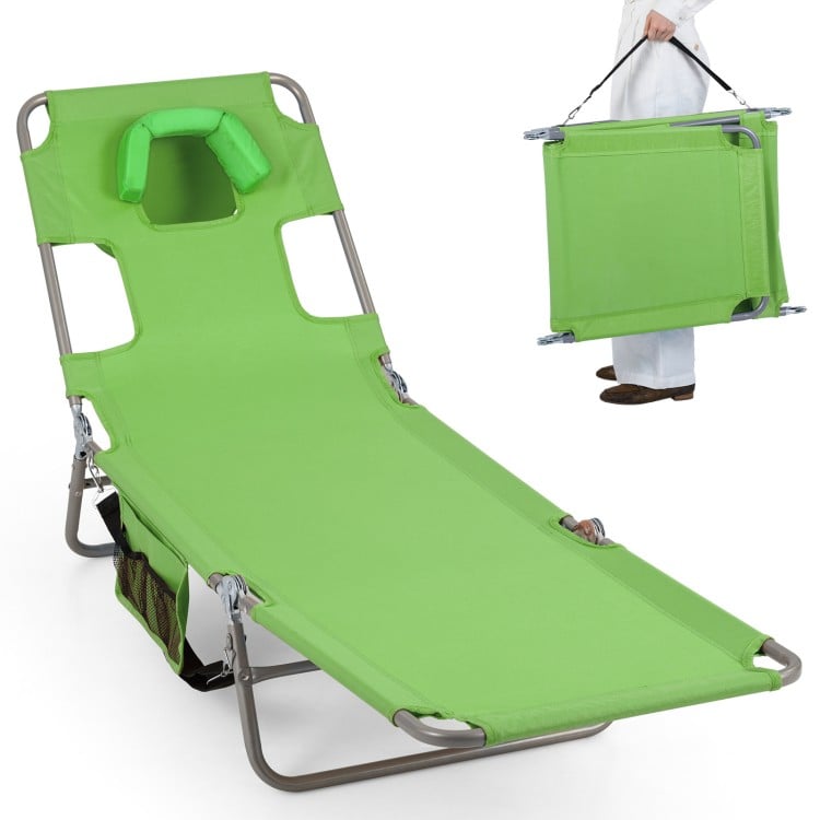 Folding beach lounge chair in lawn-green with adjustable backrest and face hole, perfect for relaxing by the pool or.