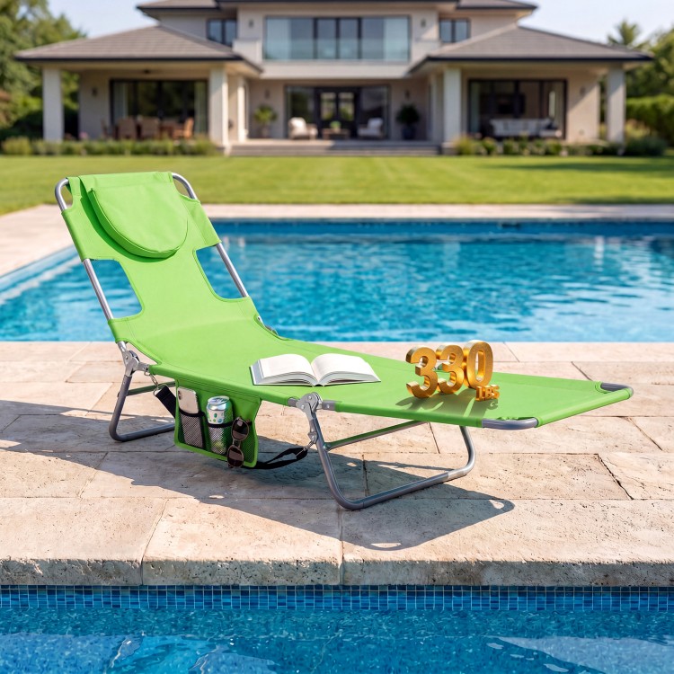 Folding beach lounge chair in lawn-green with adjustable backrest, side pocket, and face hole for versatile relaxation.