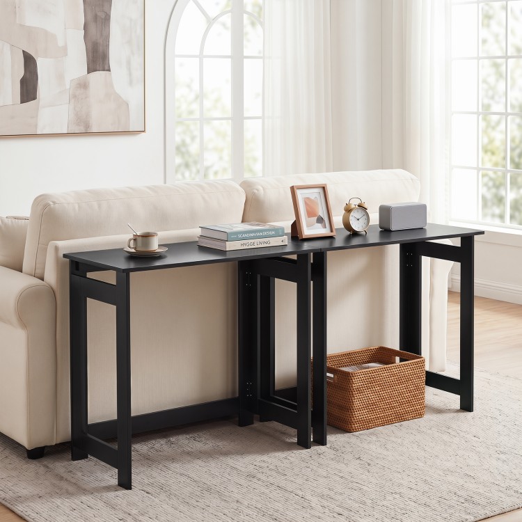 Folding console table in black with foldable legs, perfect for space-saving in living rooms or hallways.