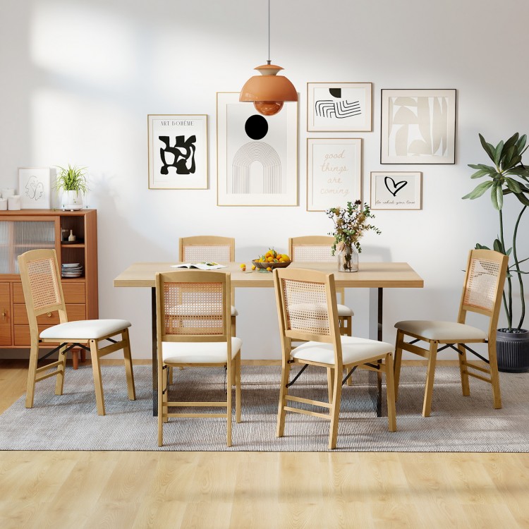 Set of 4 natural rubber wood folding dining chairs with linen padded seats and rattan backrests, ideal for dining rooms.