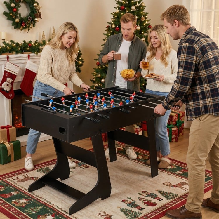 Folding foosball table in black with 22 players and slide scorers, perfect for family gatherings and game rooms.