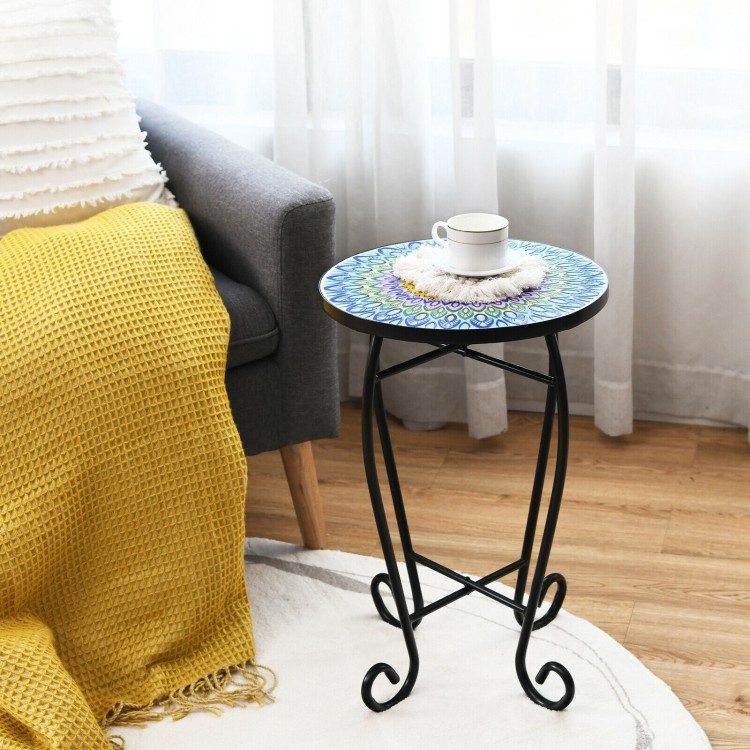 Round folding mosaic side table with ceramic tile top and steel frame, perfect for indoor or outdoor use beside a sofa.
