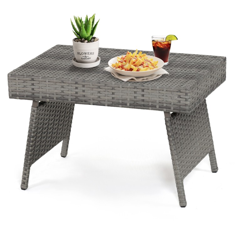 Folding gray PE rattan coffee table with wide top, perfect for outdoor use and easy storage when not in use.
