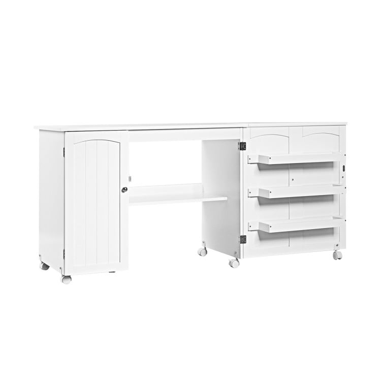 Folding sewing table in white with three storage bins, extra shelf, and wheels for easy mobility and organization.