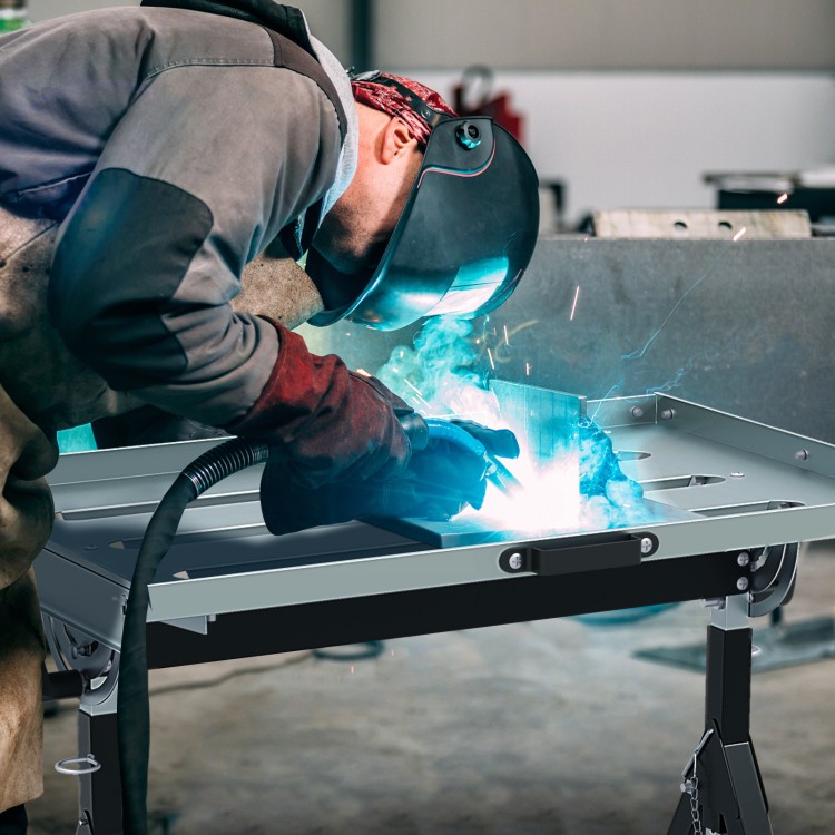Folding welding table with adjustable height, tiltable tabletop, and tool slots, ideal for efficient welding work.