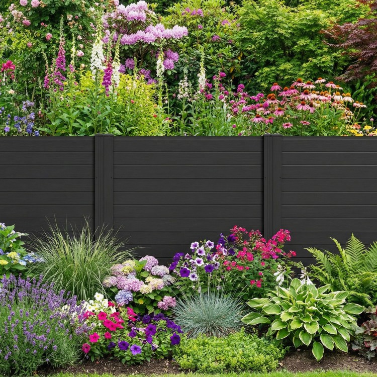 Freestanding black air conditioner fence with vibrant garden backdrop, featuring heavy-duty metal stakes for stability.
