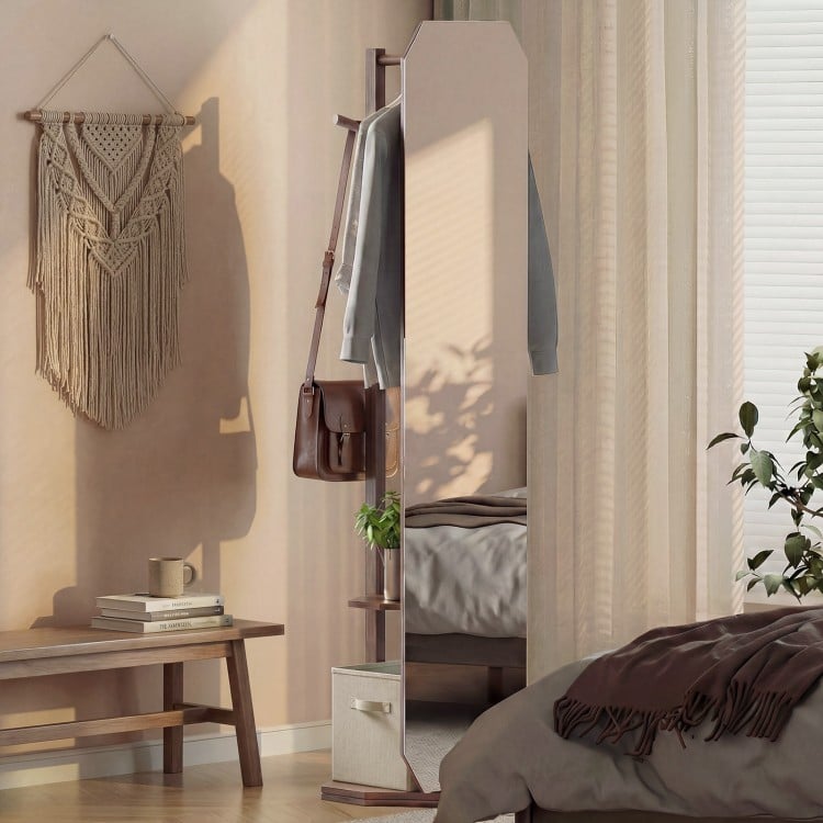 Full-length mirror coat rack in walnut with shelves and hooks, ideal for bedroom or entryway storage and organization.