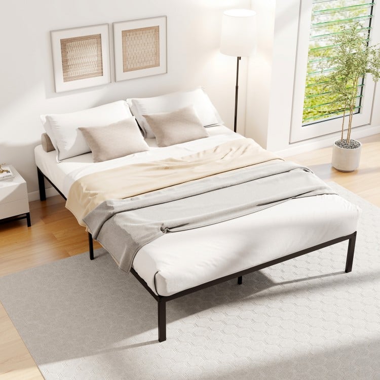 Full-size metal bed frame with heavy-duty support slats, minimalist design, and ample under-bed storage for bedroom use.