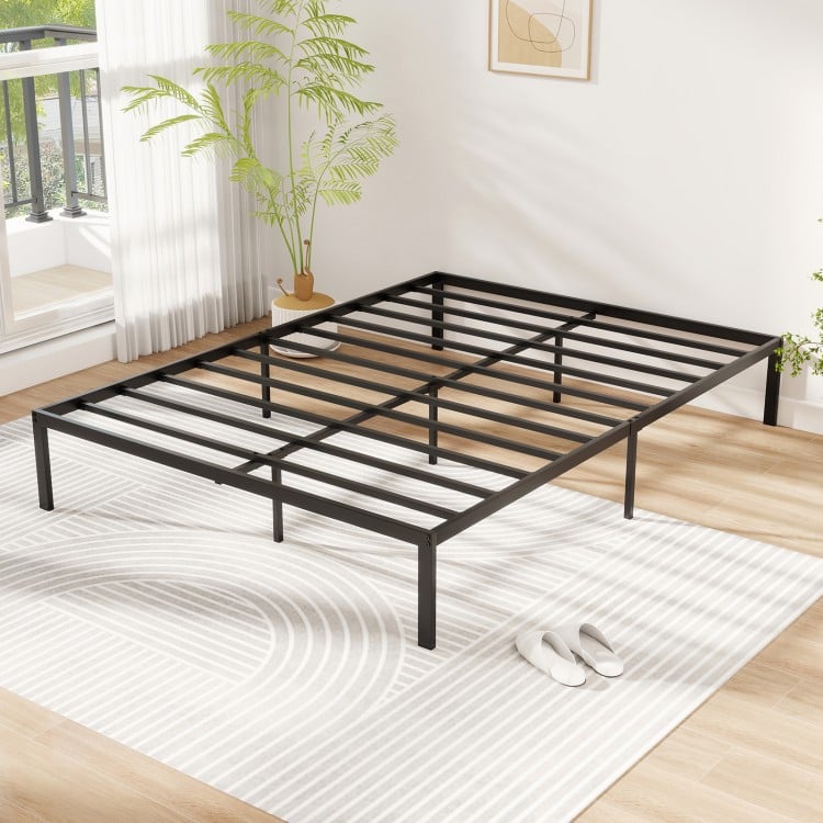 Full-size metal bed frame with heavy-duty slats, minimalist design, and ample under-bed storage for a stylish bedroom.