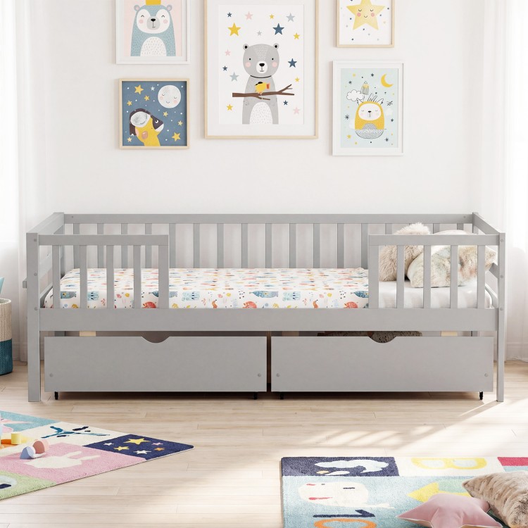 Gray full-size daybed with fence and two storage drawers, perfect for children's rooms and organized play areas.