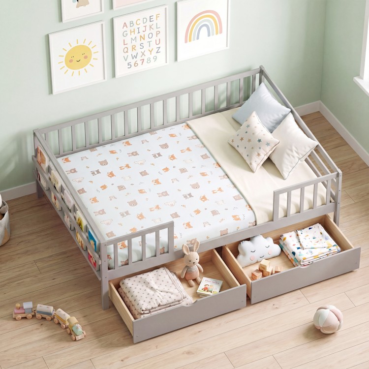 Full-size gray daybed with fence, two pull-out drawers, and safety guardrail for children's room organization.