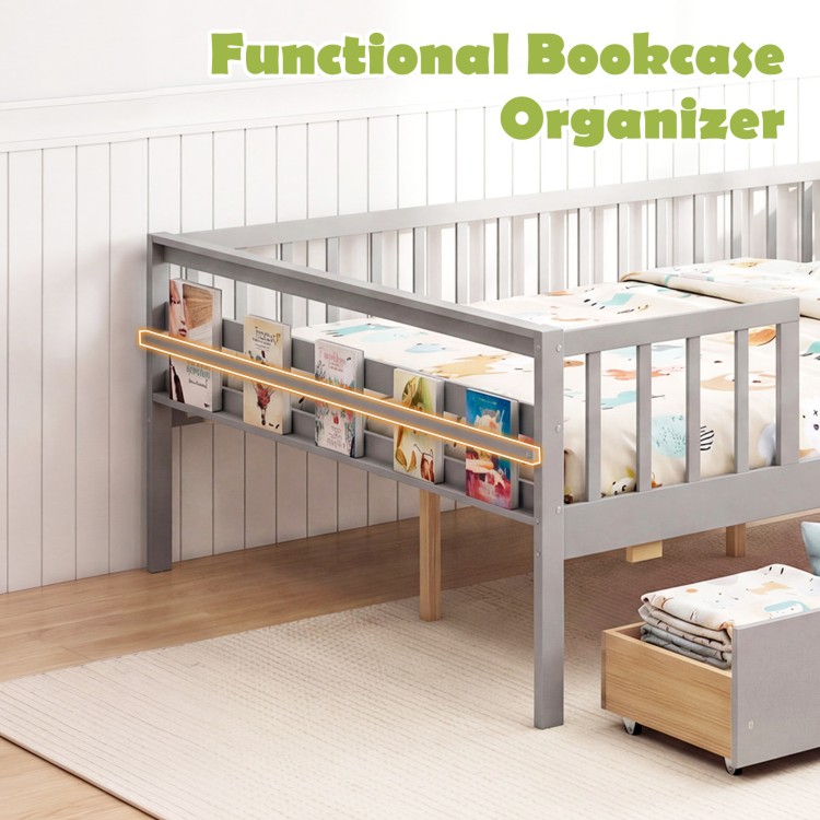 Full size gray daybed with fence, two drawers, and side storage shelf for children's books and toys.