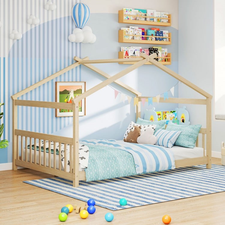 House-shaped Montessori floor bed in white with supportive headboard, designed for children's creativity and comfort.