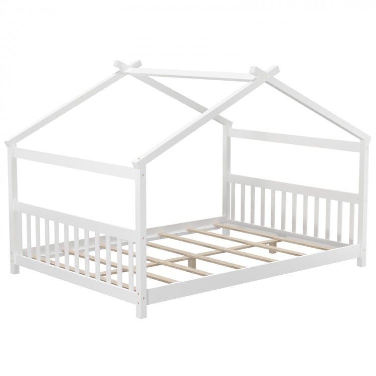 Montessori floor bed in white with a house design, featuring solid wood legs and a supportive headboard for kids' play.