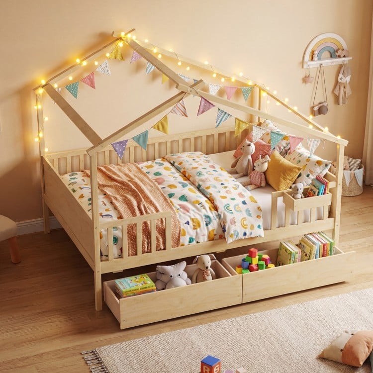 House-shaped full-size bed with fence rails, natural wood, featuring storage drawers and playful design for kids.