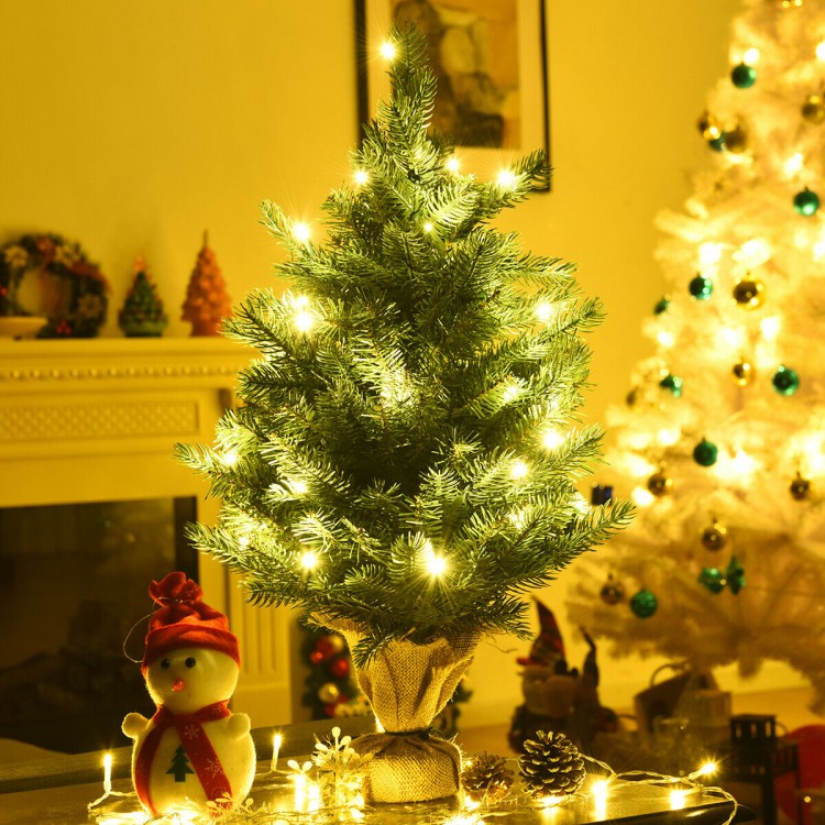24-inch tabletop fir artificial Christmas tree with 35 warm white LED lights, perfect for festive home decoration.