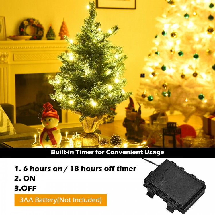 24-inch tabletop fir artificial Christmas tree with 35 warm white LED lights, featuring a built-in timer for.