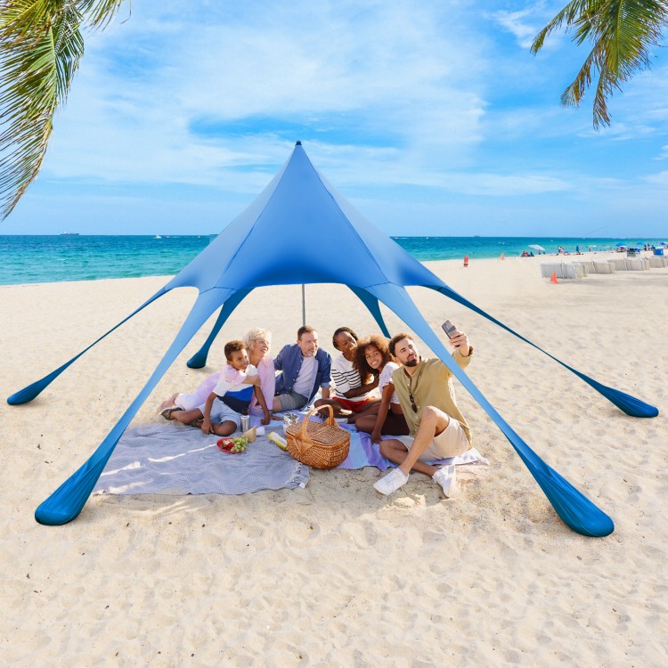 Spacious 20x20 feet blue beach canopy tent with UPF50+ sun protection, set up for 2-3 people on the sand.