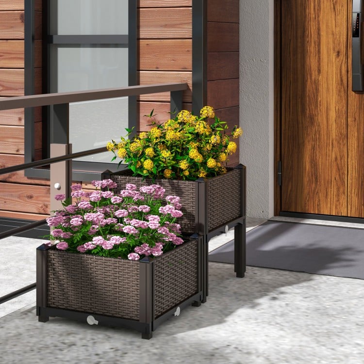Elevated plastic raised garden bed planter kit in brown with vibrant flowers, perfect for outdoor gardening.